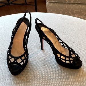 Black suede Louboutin slingbacks